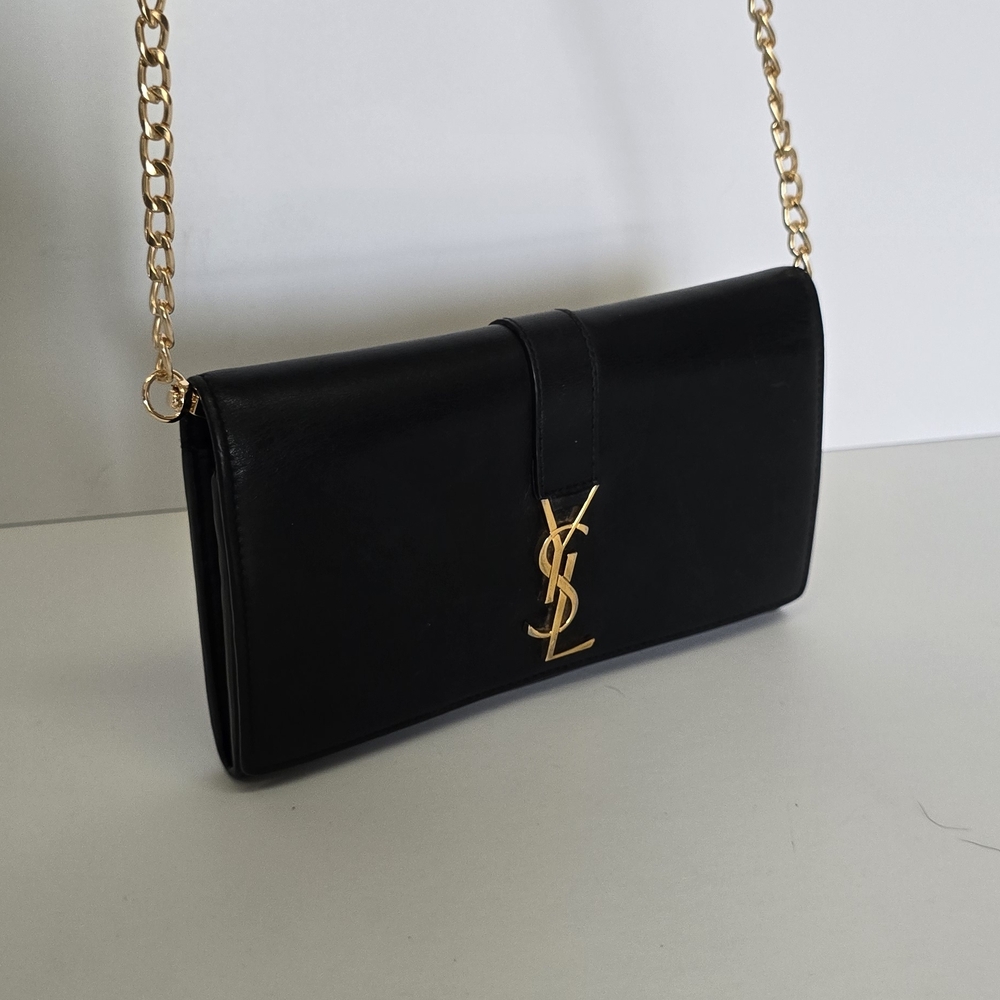 Yves Saint Laurent Elegant Black Clutch with Gold Accents